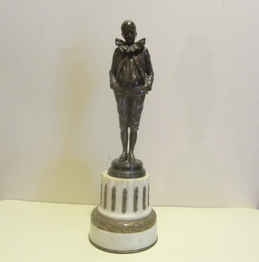 Antique bronze sculpture of a Pierrot by Jean Garnier, on an intricately decorated marble base. 