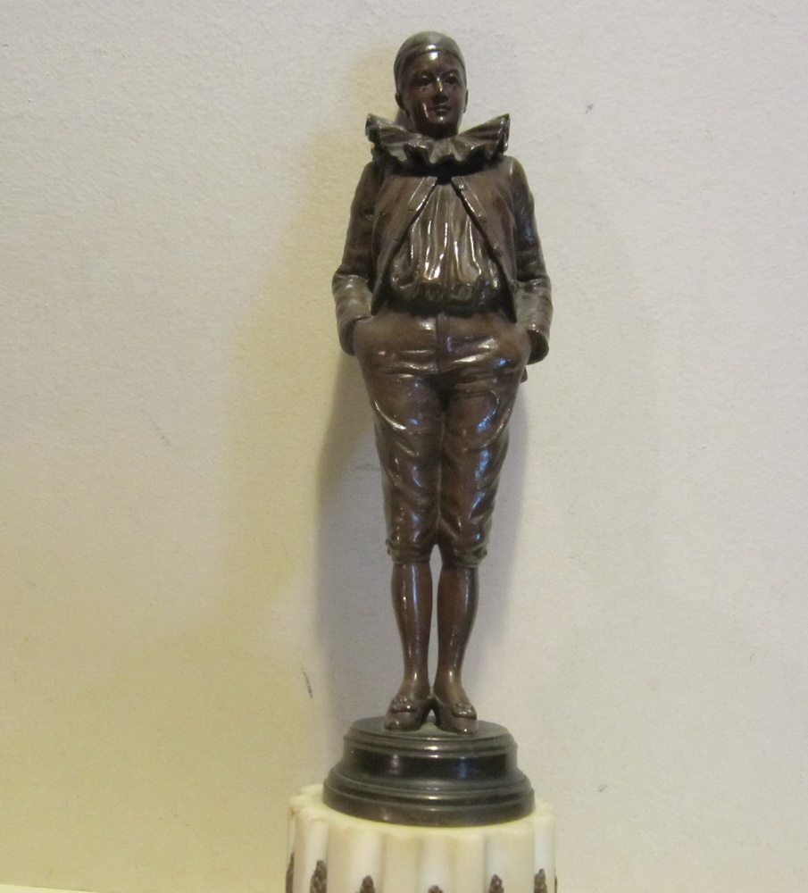 Antique bronze sculpture of a Pierrot by Jean Garnier, on an intricately decorated marble base. 