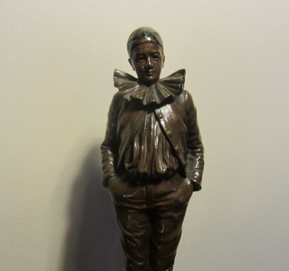 Antique bronze sculpture of a Pierrot by Jean Garnier, on an intricately decorated marble base. 